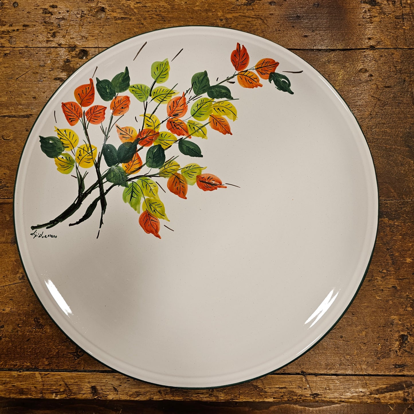 Round ceramic serving plate decorated with strawberries