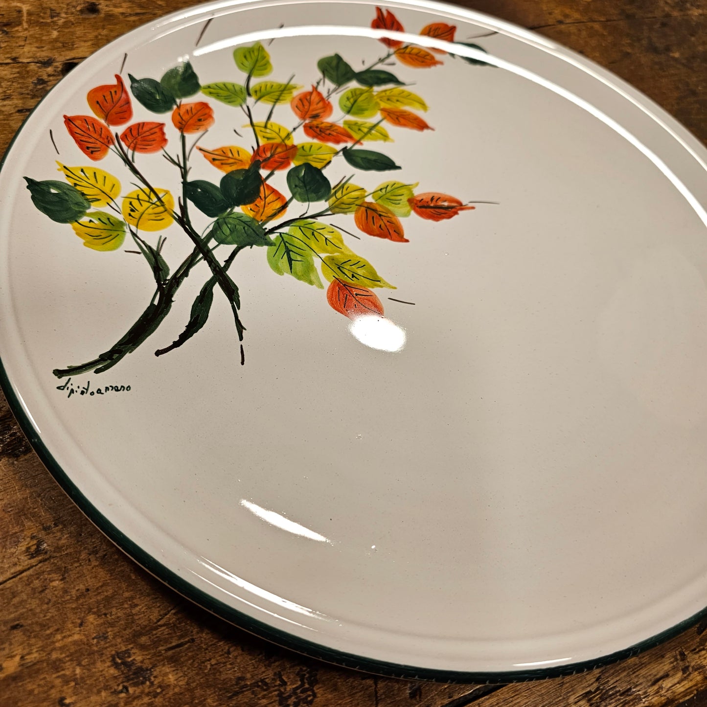 Round ceramic serving plate decorated with strawberries