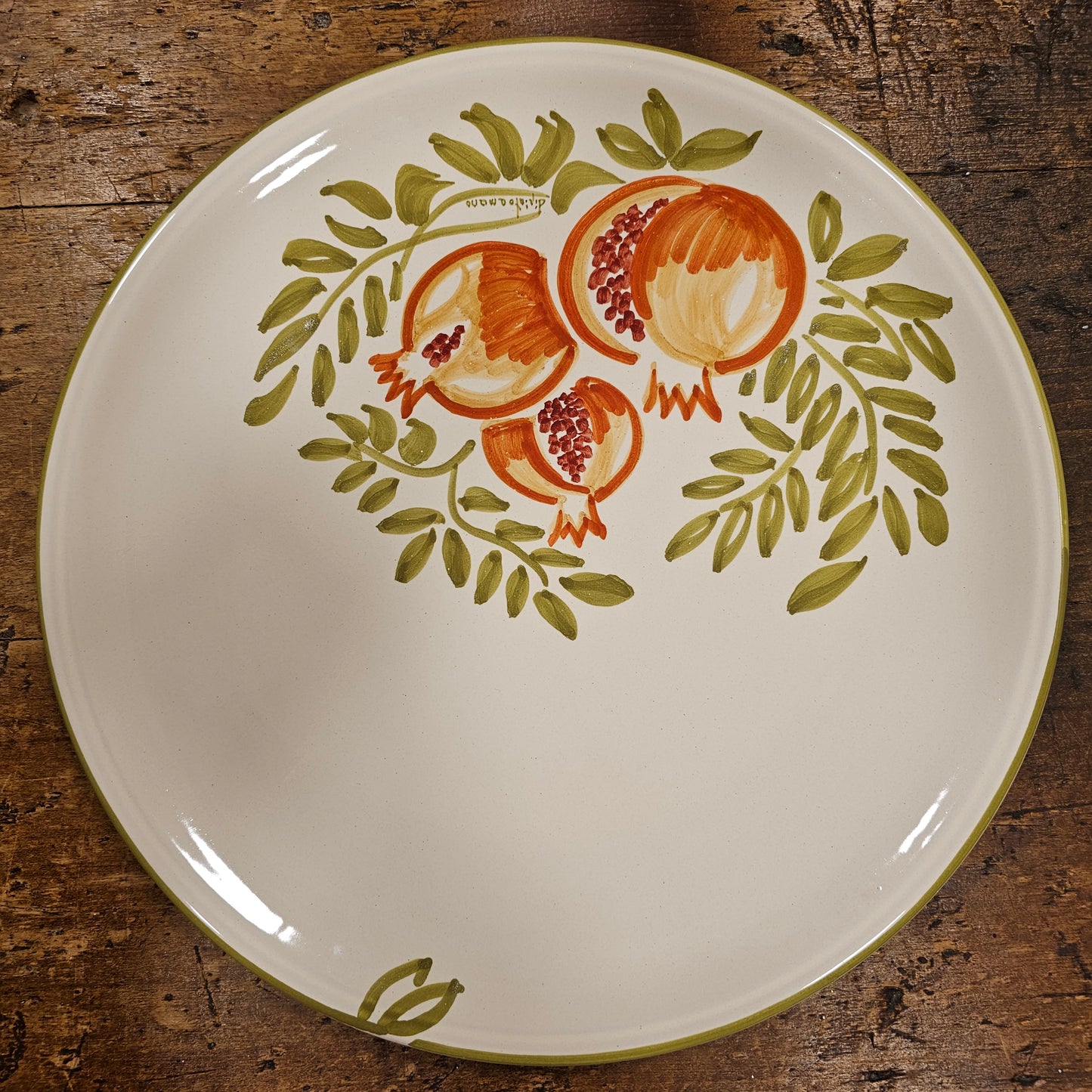 Round ceramic serving plate decorated with strawberries