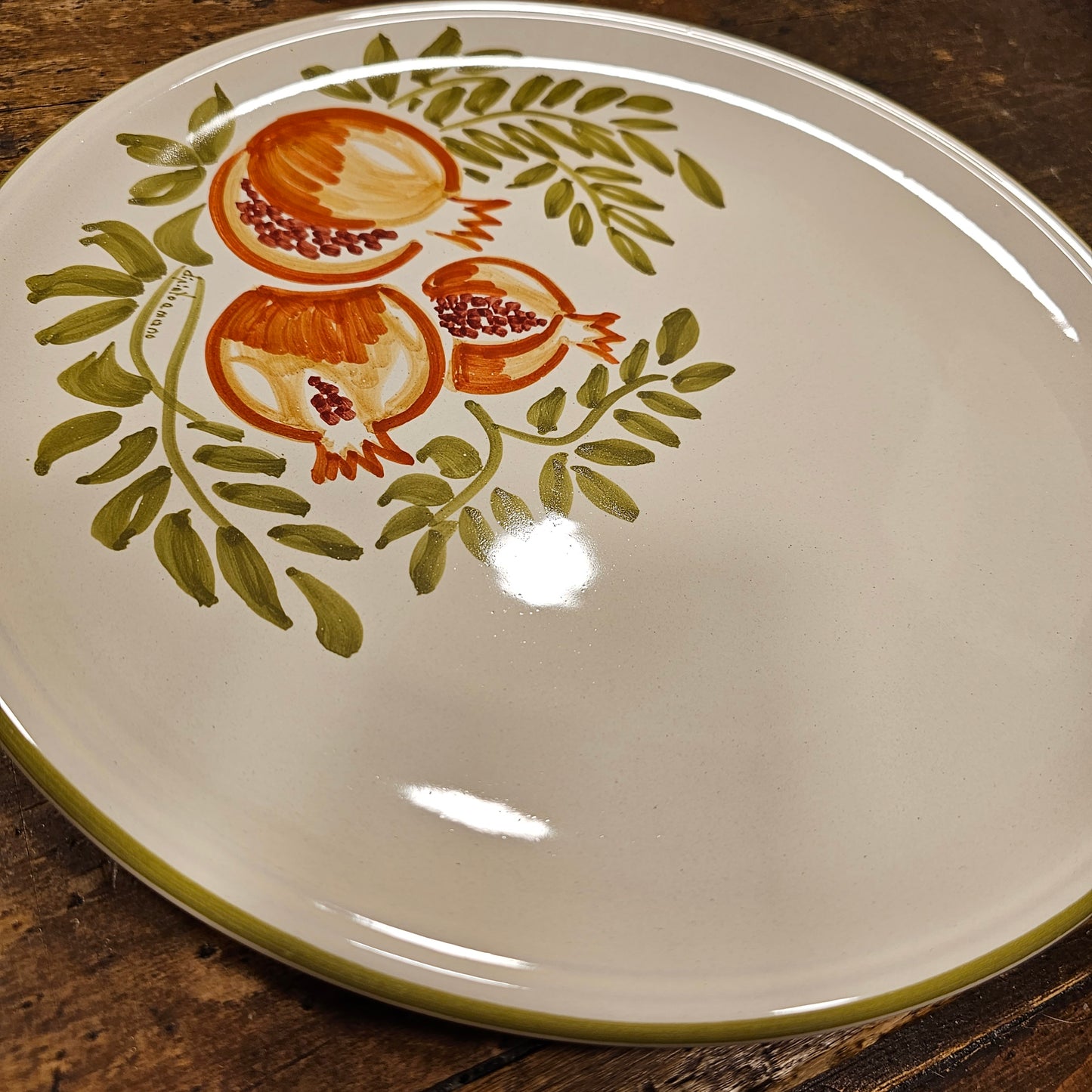 Round ceramic serving plate decorated with strawberries