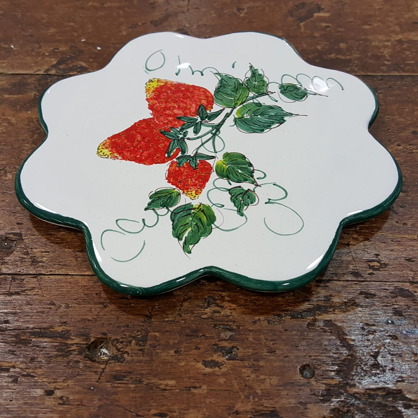 Ceramic trivet with strawberry flower decoration