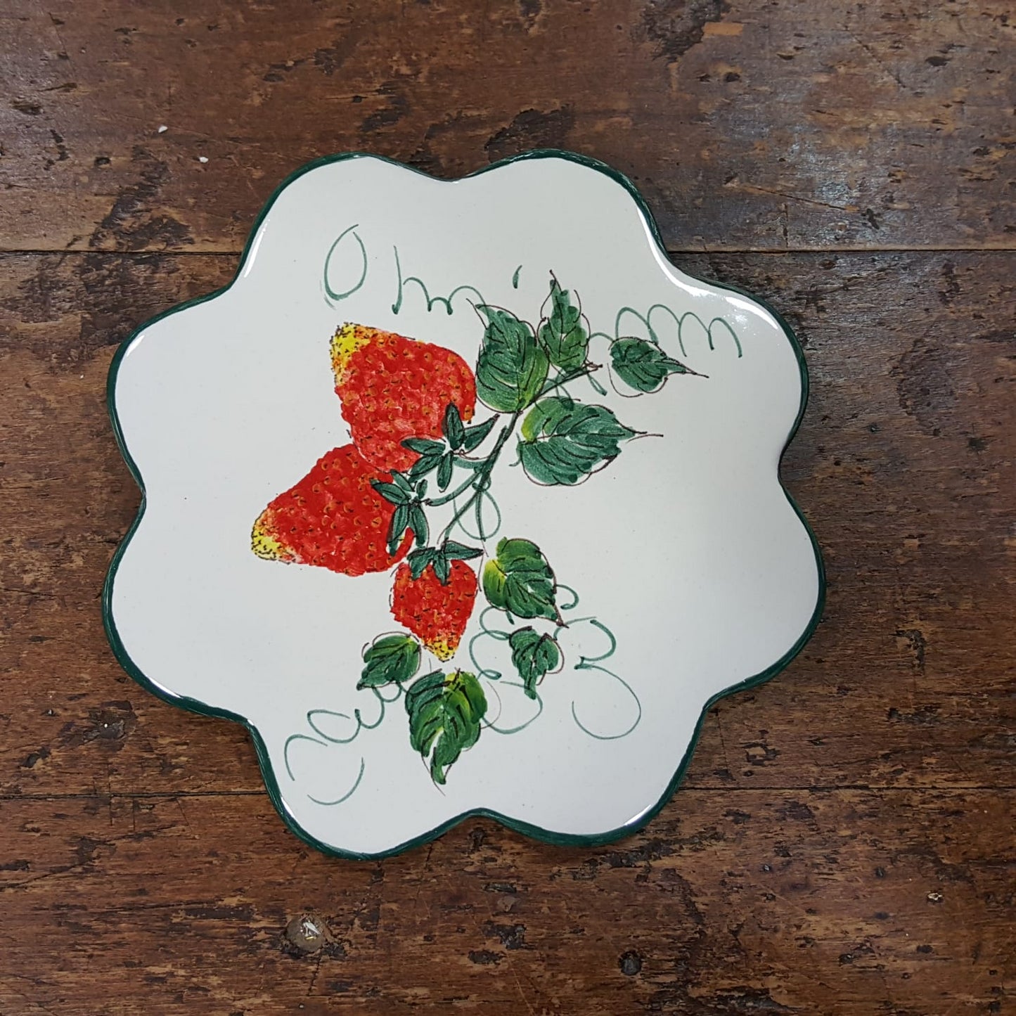 Ceramic trivet with strawberry flower decoration