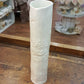 Porcelain tube vase with floral imprint