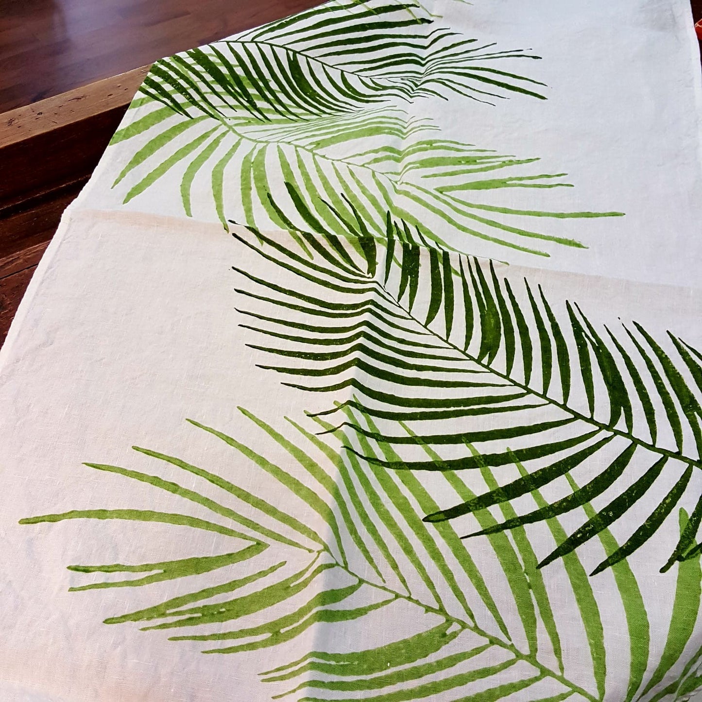 Hand printed table runner with palm tree design