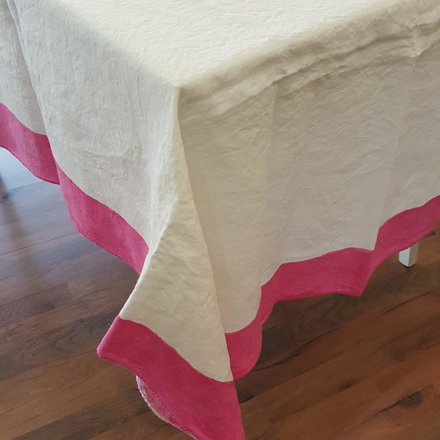 Natural linen tablecloth with painted border in Fuchsia colour