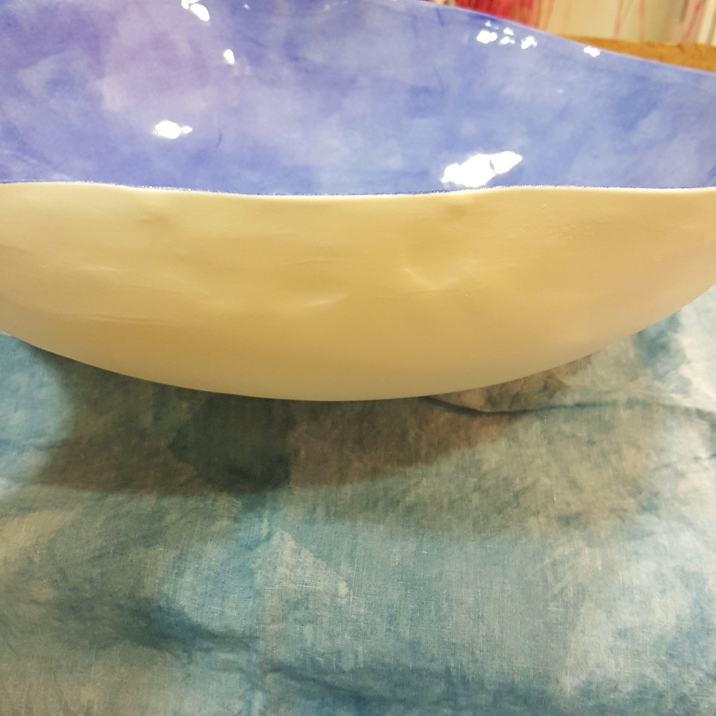 Handmade porcelain bowl with light blue background