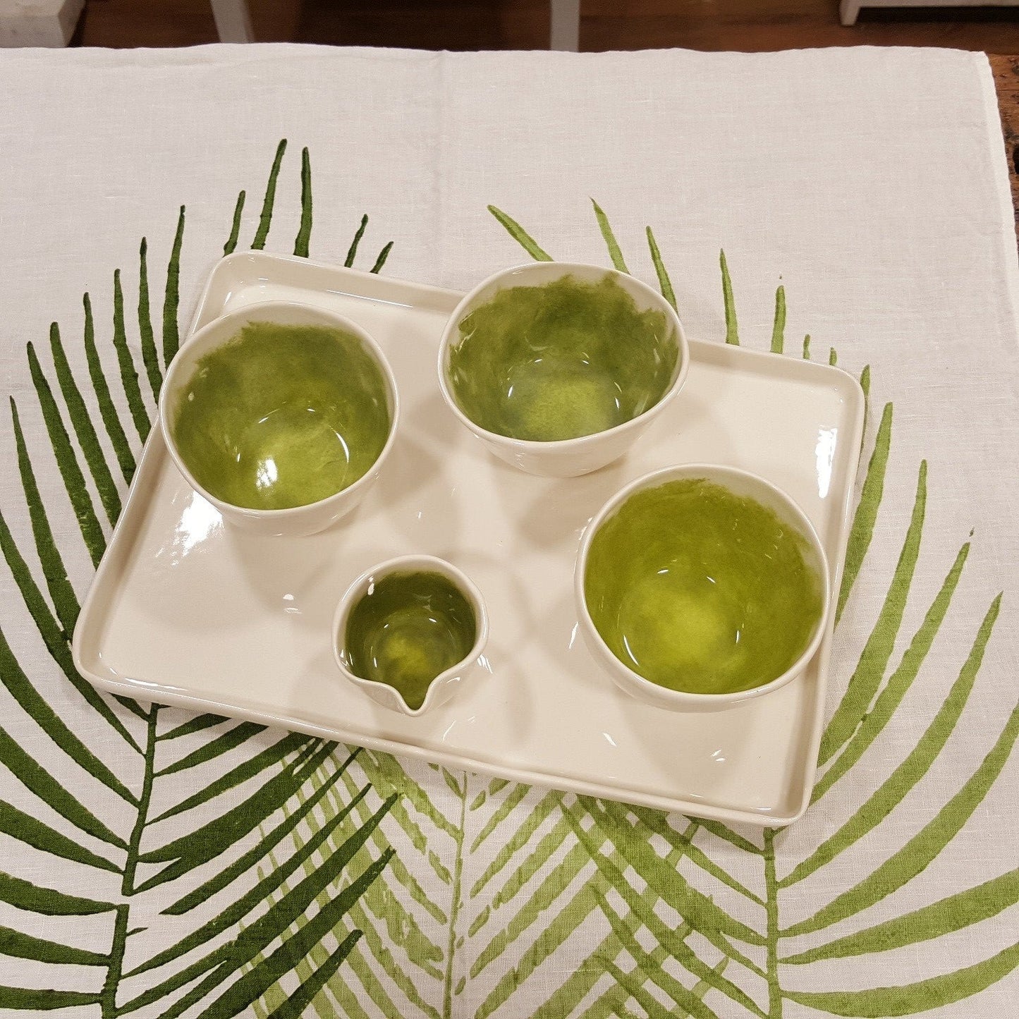 Coffee service with brushed green porcelain milk jug.