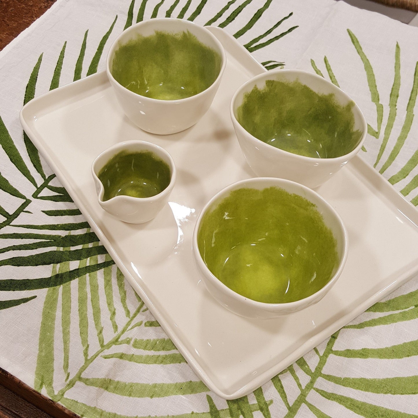 Coffee service with brushed green porcelain milk jug.