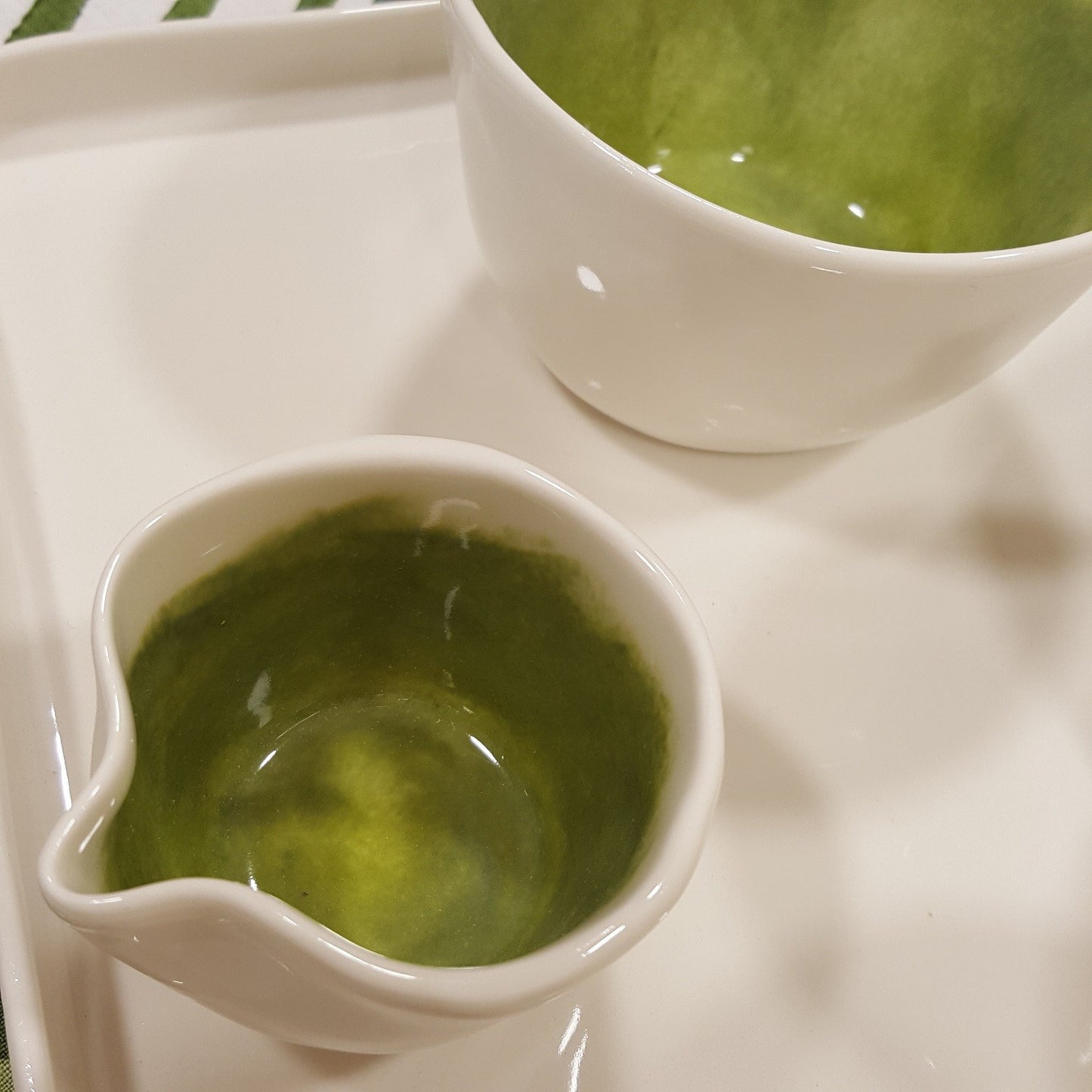 Coffee service with brushed green porcelain milk jug.