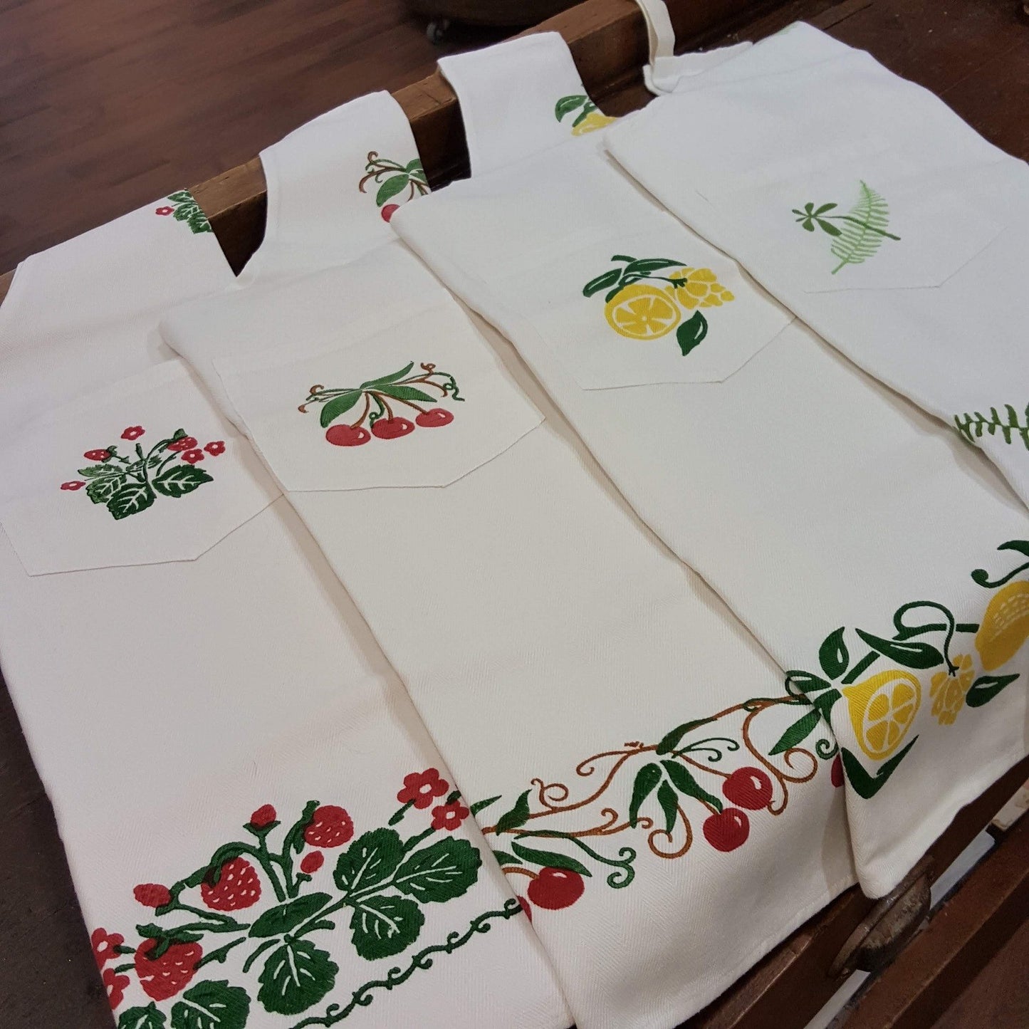 Hand printed apron decorating strawberries, cherries, lemons or fern