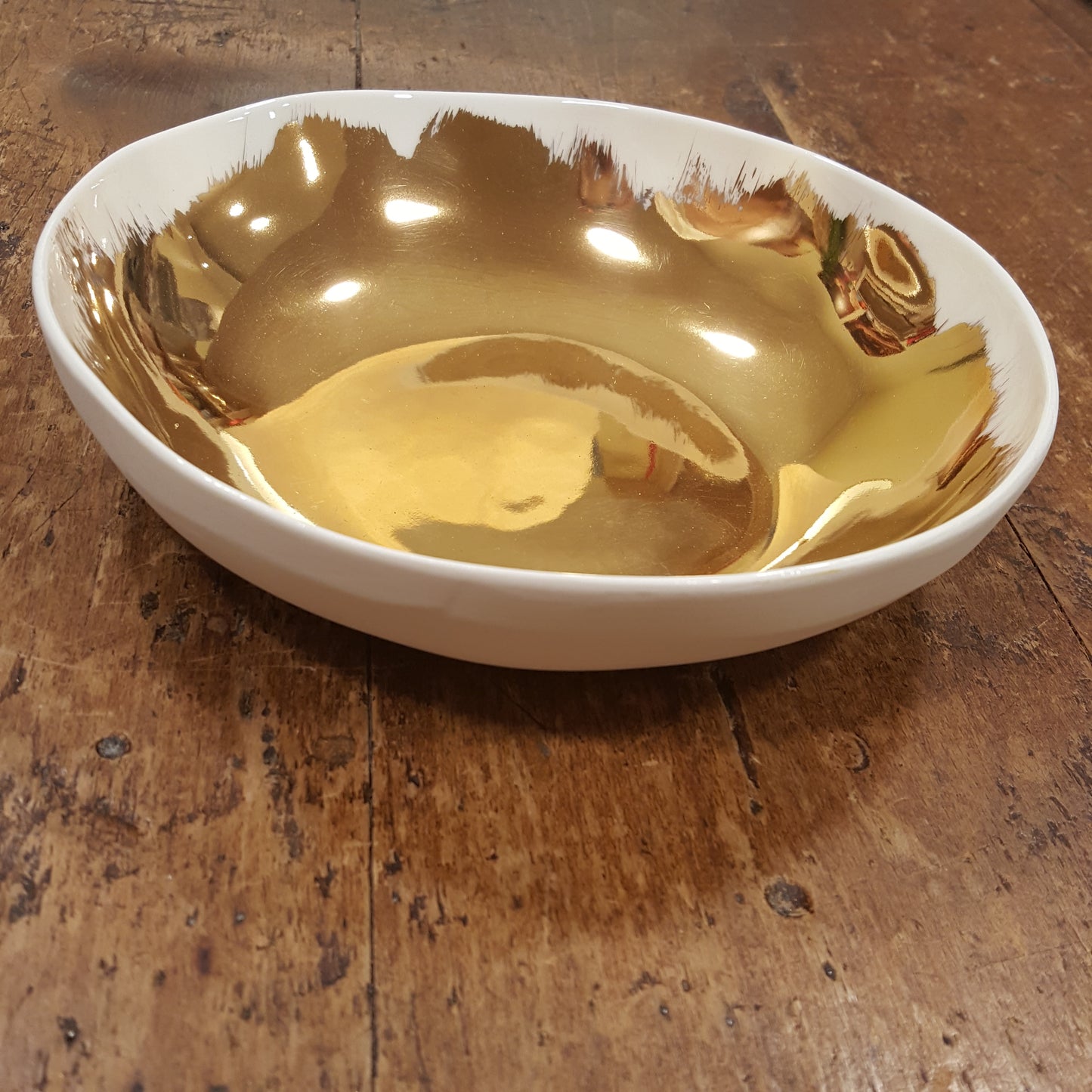 Bowl in porcellana spennellata oro