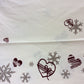 Christmas tablecloth in natural linen with bows and hearts print