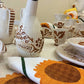 Ceramic table service with sunflower decoration