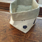 Storage basket in washable paper from the L'Heure Bleue collection
