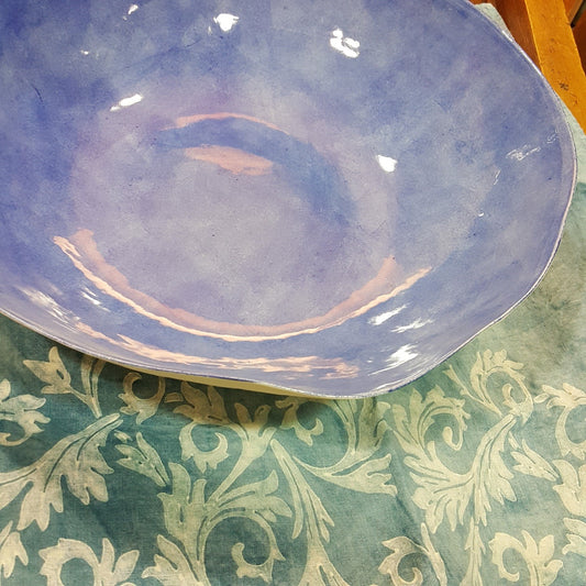 Handmade porcelain bowl with light blue background