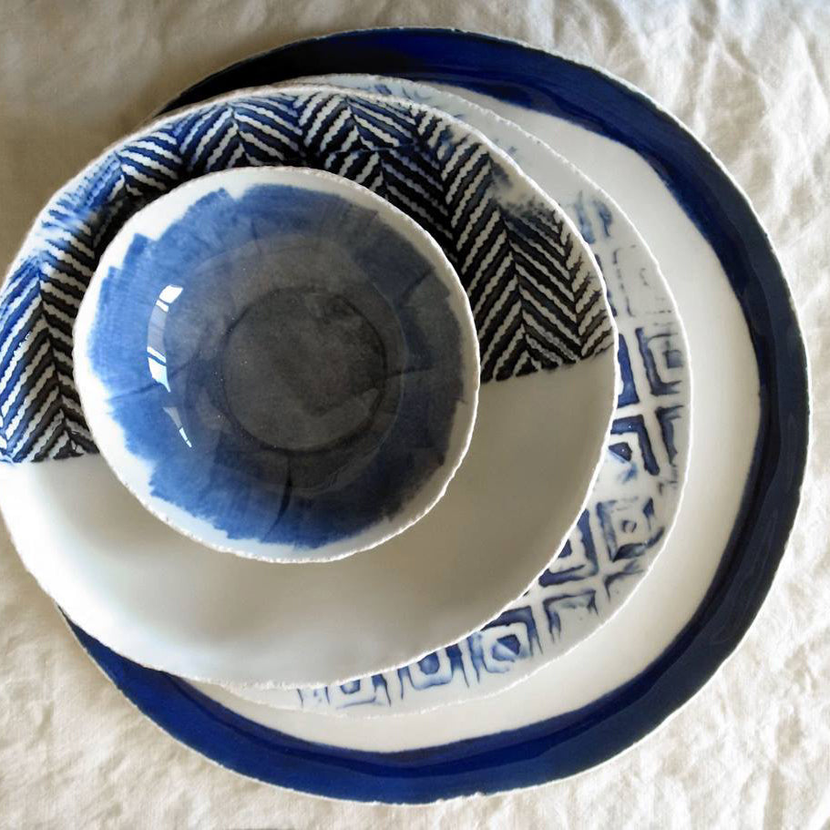 Set of blue plates with colored imprint in porcelain