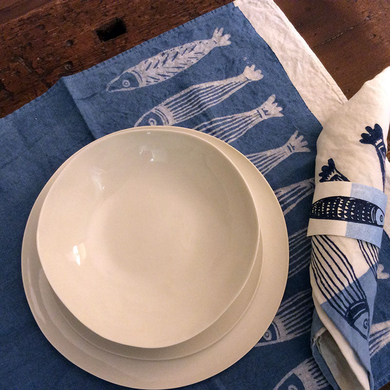 Plates set in shiny white porcelain handmade