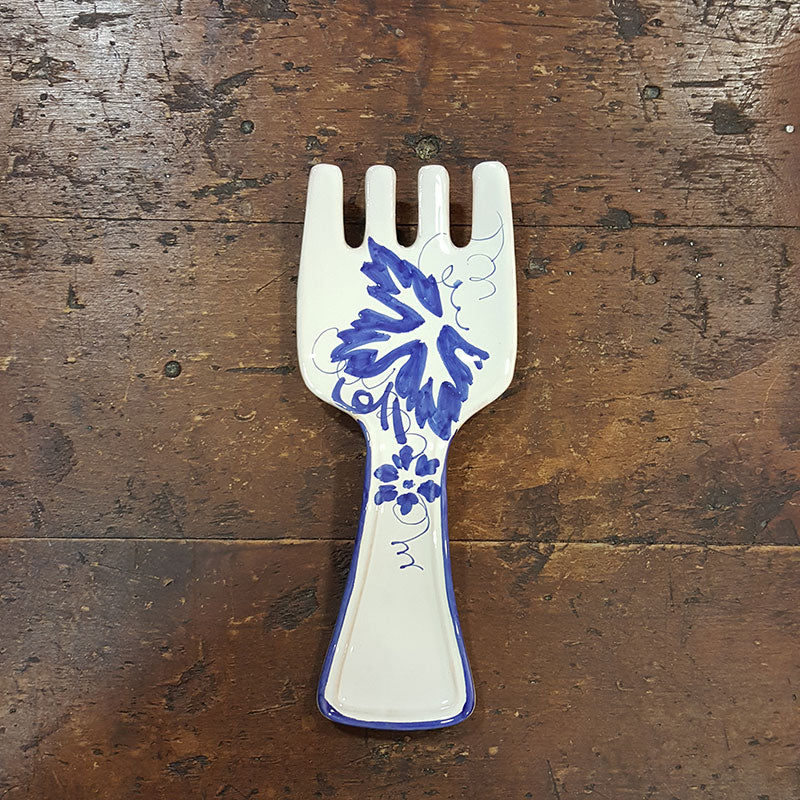 Fork-shaped kitchen spoon rest in ceramic