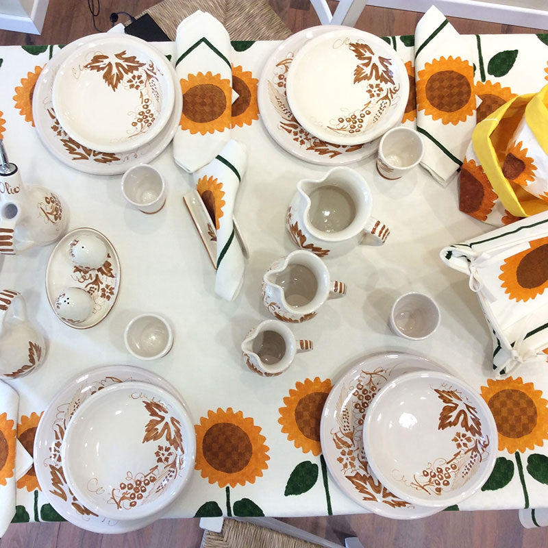 Ceramic table service with sunflower decoration