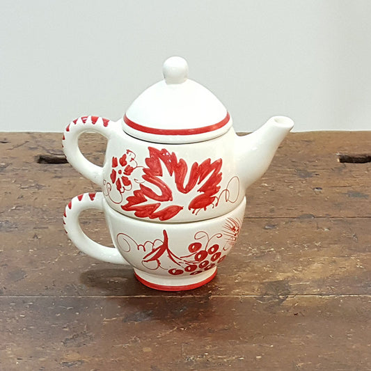 Ceramic teapot with cup