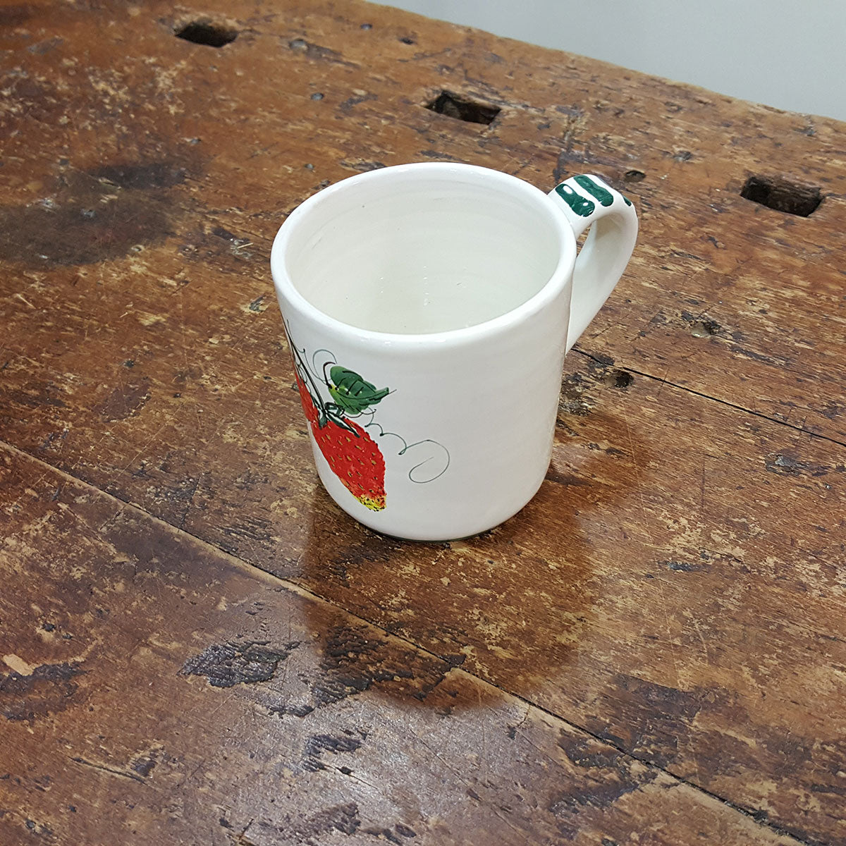 Strawberry decorated ceramic mug