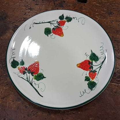 Round ceramic serving plate decorated with strawberries